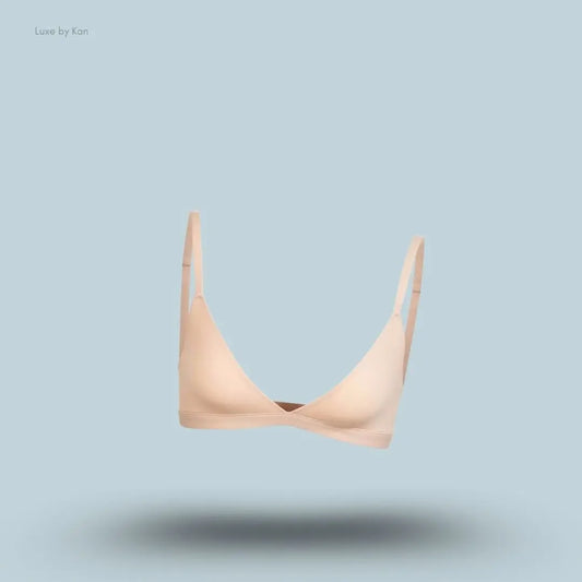 Skims Fits Everybody Triangle Bralette in nude, front view on a light blue background with a floating product display.