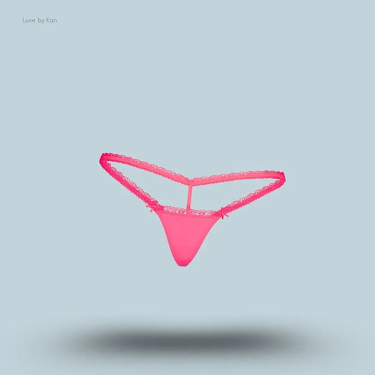 SKIMS Fits Everybody Lace Micro Thong in Ultra Pink, flat lay on light blue background