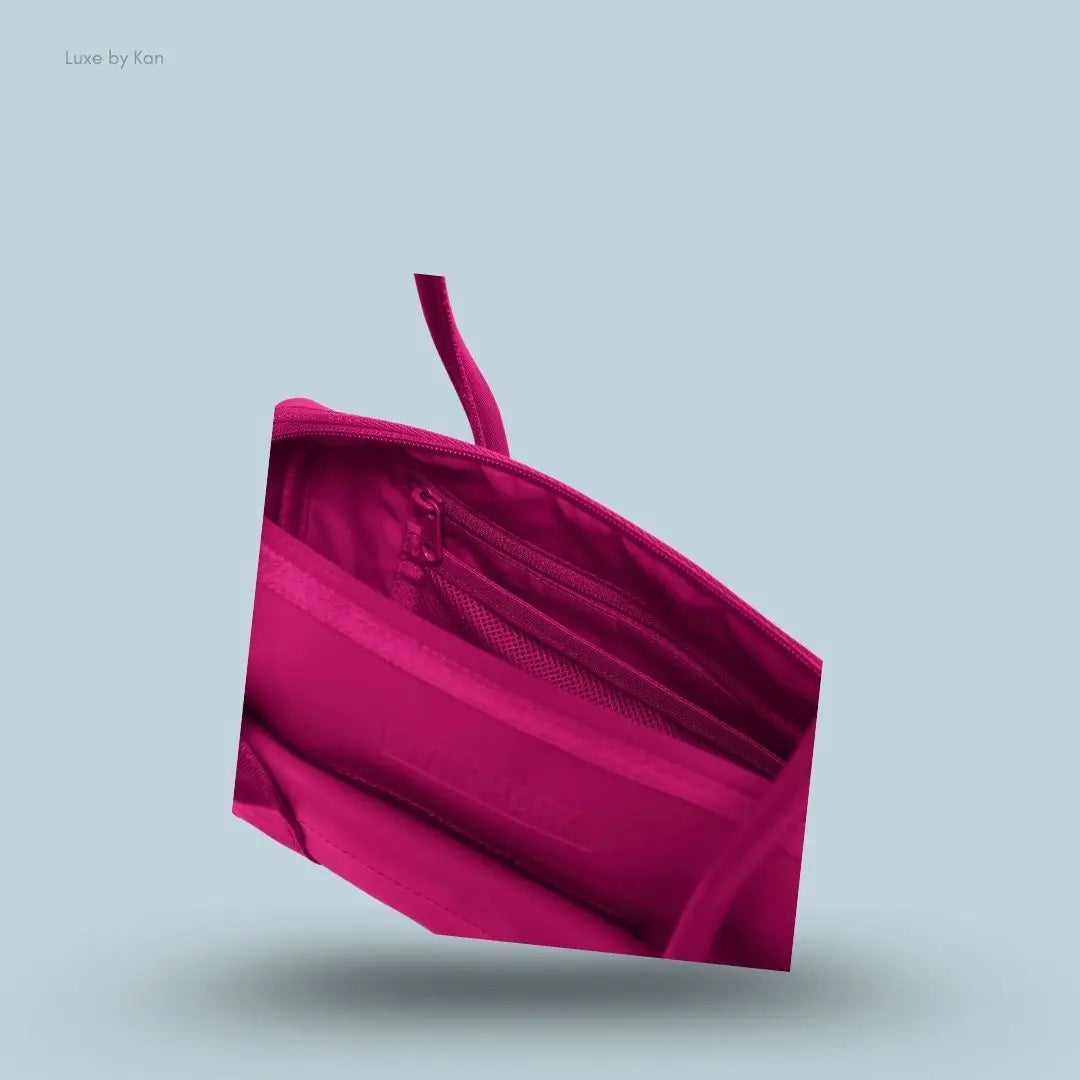 Gymshark Everyday Baguette Bag in pink displayed on a blue background with a bag storage details