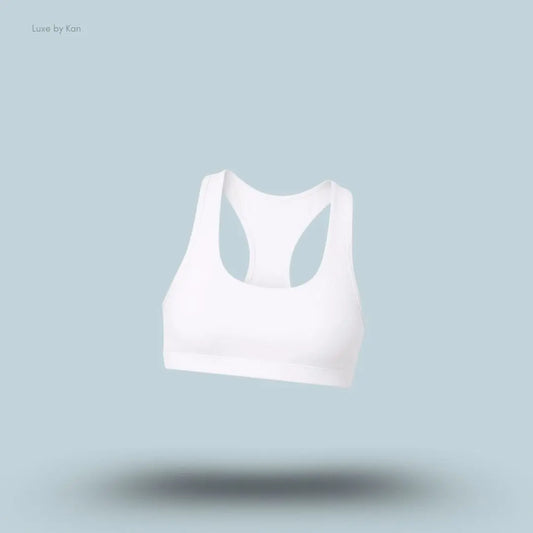 Alo Airlift Advantage Racerback Bra in White, flat lay on light blue background