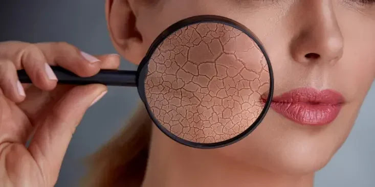A hand holds a black facial treatment tool against skin, showcasing a textured, Dry Skin, emphasizing skincare routines.