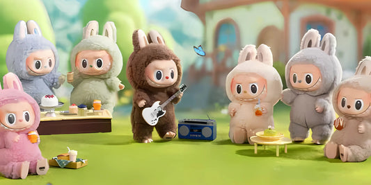 A group of cute Labubu doll characters in bunny costumes enjoys a picnic with food and music in a vibrant outdoor setting.