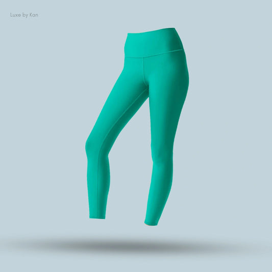 Alo High-Waist Airlift Legging in green, flat lay on light blue background