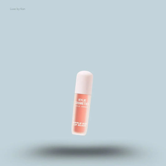 Kylie Cosmetics Supple Kiss Lip Glaze 3ml bottle on blue background — Luxe by Kan India
