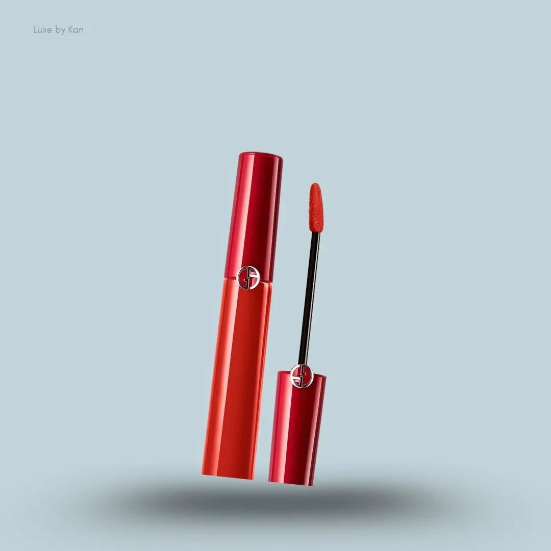 Armani Beauty Lip Maestro Intense Liquid Lipstick bottle with applicator on blue background — LBK