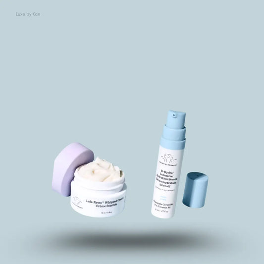 Drunk Elephant Hydrate and Nourish Set two open products on a blue background