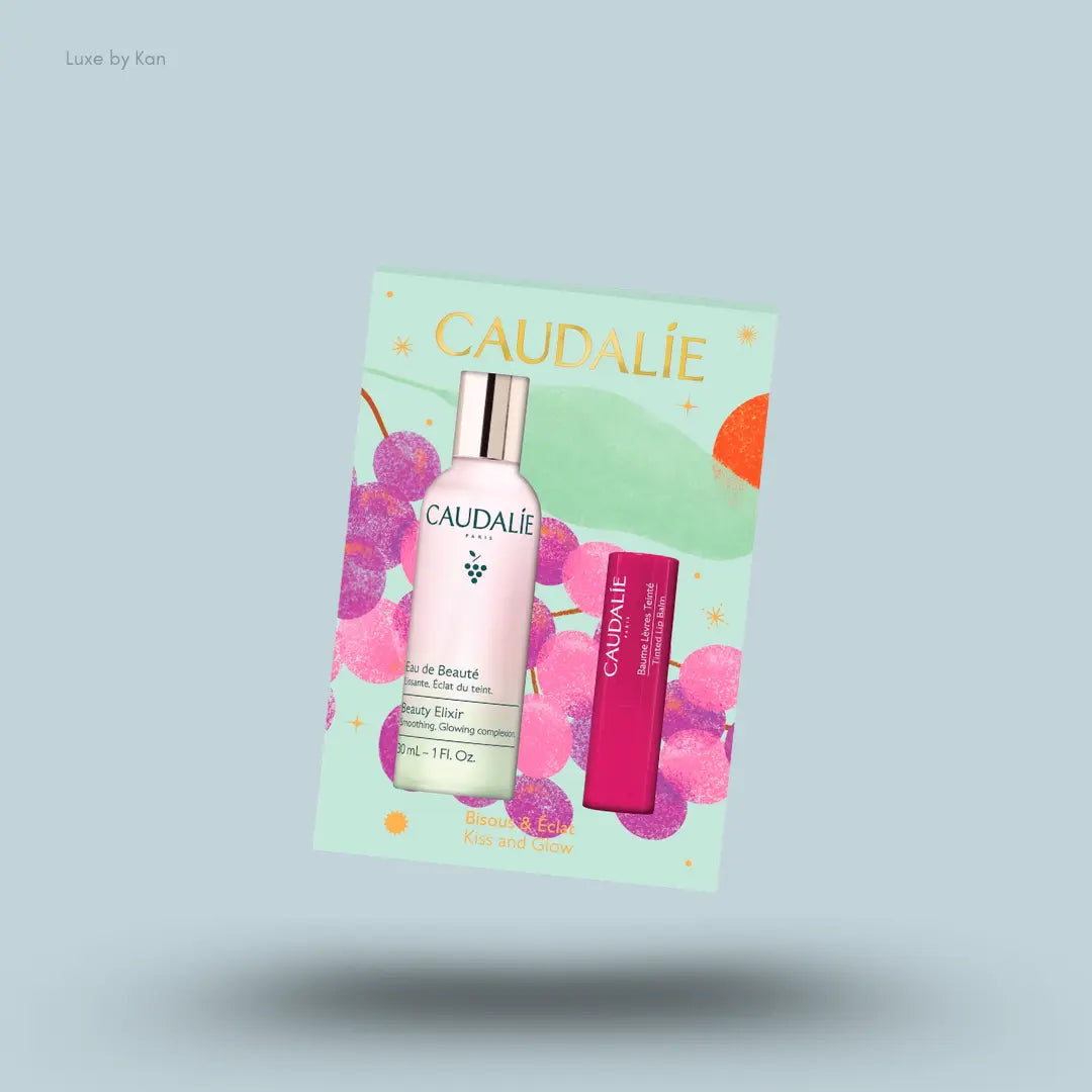 Caudalie Beauty Elixir & Tinted Lip Balm Duo face mist and lip balm with box on blue background
