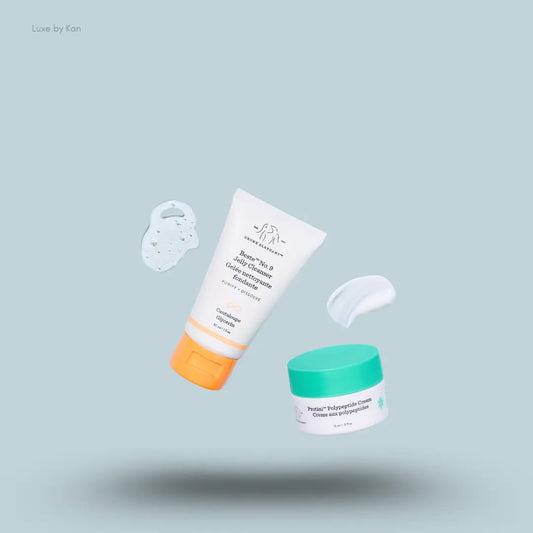 Drunk Elephant The Essentials Edit two products with texture swatches on a blue background