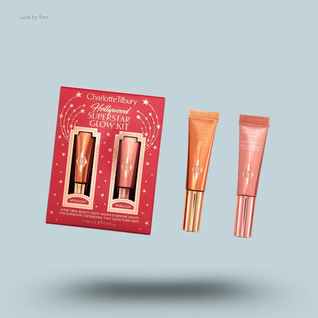 Charlotte Tilbury Hollywood Superstar Glow Kit – two Hollywood Beauty Light Wands with packaging on blue background