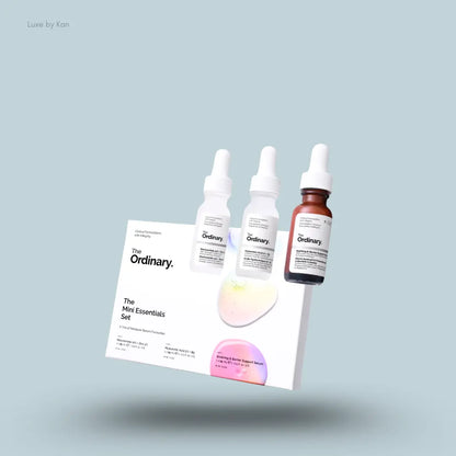 The Ordinary Mini Essentials Set three serum bottles with box on blue background