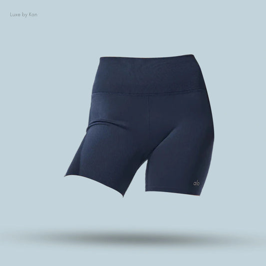 Alo 5 inch Seamless Ribbed Favorite Short in navy, flat lay on light blue background
