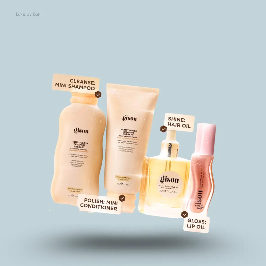 Gisou Shower to Shine Kit four honey haircare and lip products on a blue background