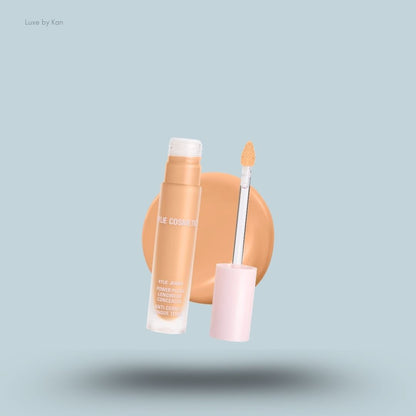 Kylie Cosmetics Power Plush Longwear Concealer bottle and swatch on blue background — LBK India