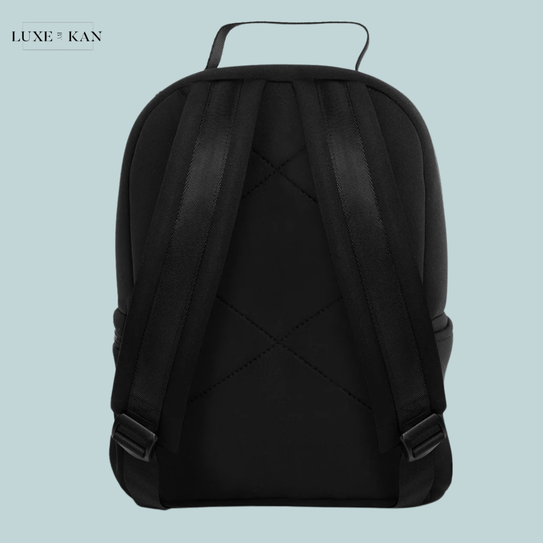 Back view of a stylish black stow backpack with adjustable straps and a top handle.
