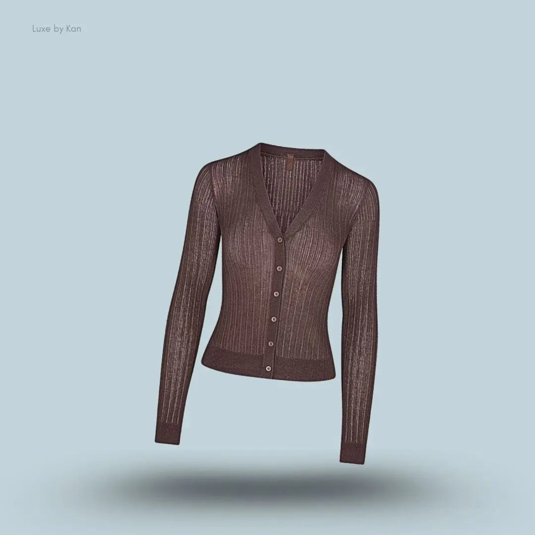 SKIMS Sheer Knit Cardigan in Amethyst, flat lay on light blue background