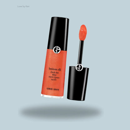 Armani Beauty Luminous Silk Cheek Tint in a soft coral shade, housed in a sleek tube with a built-in applicator for effortless, radiant color.