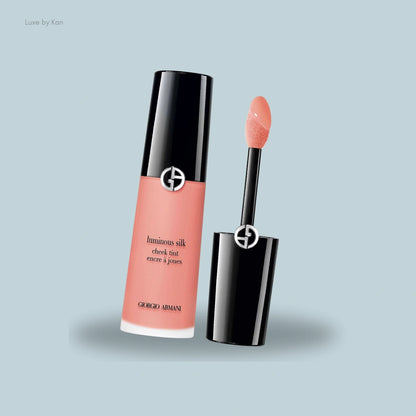 Armani Beauty Luminous Silk cheek tint with applicator emerging from the tube.