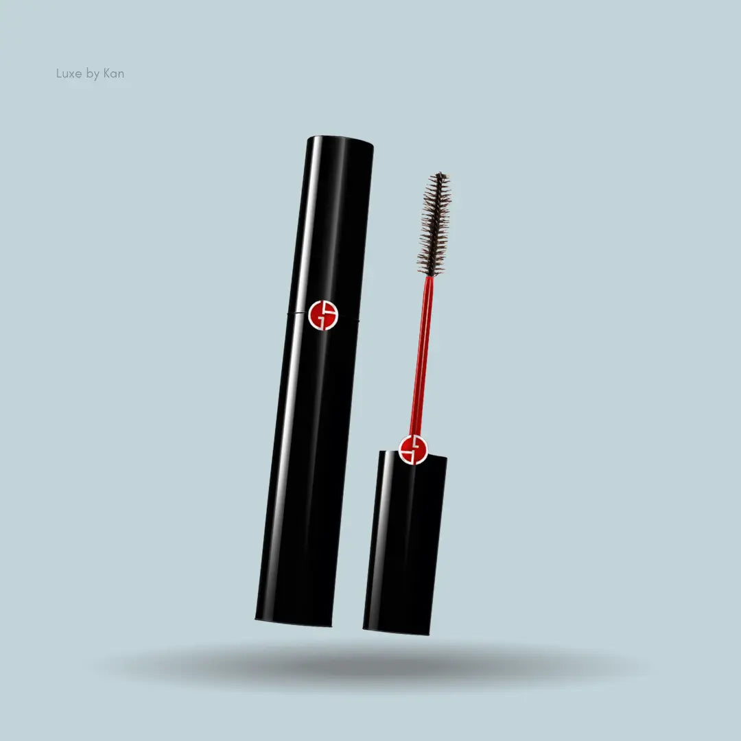 Armani Beauty Black Ecstasy Mascara black bottle with mascara applicator on blue background — LBK