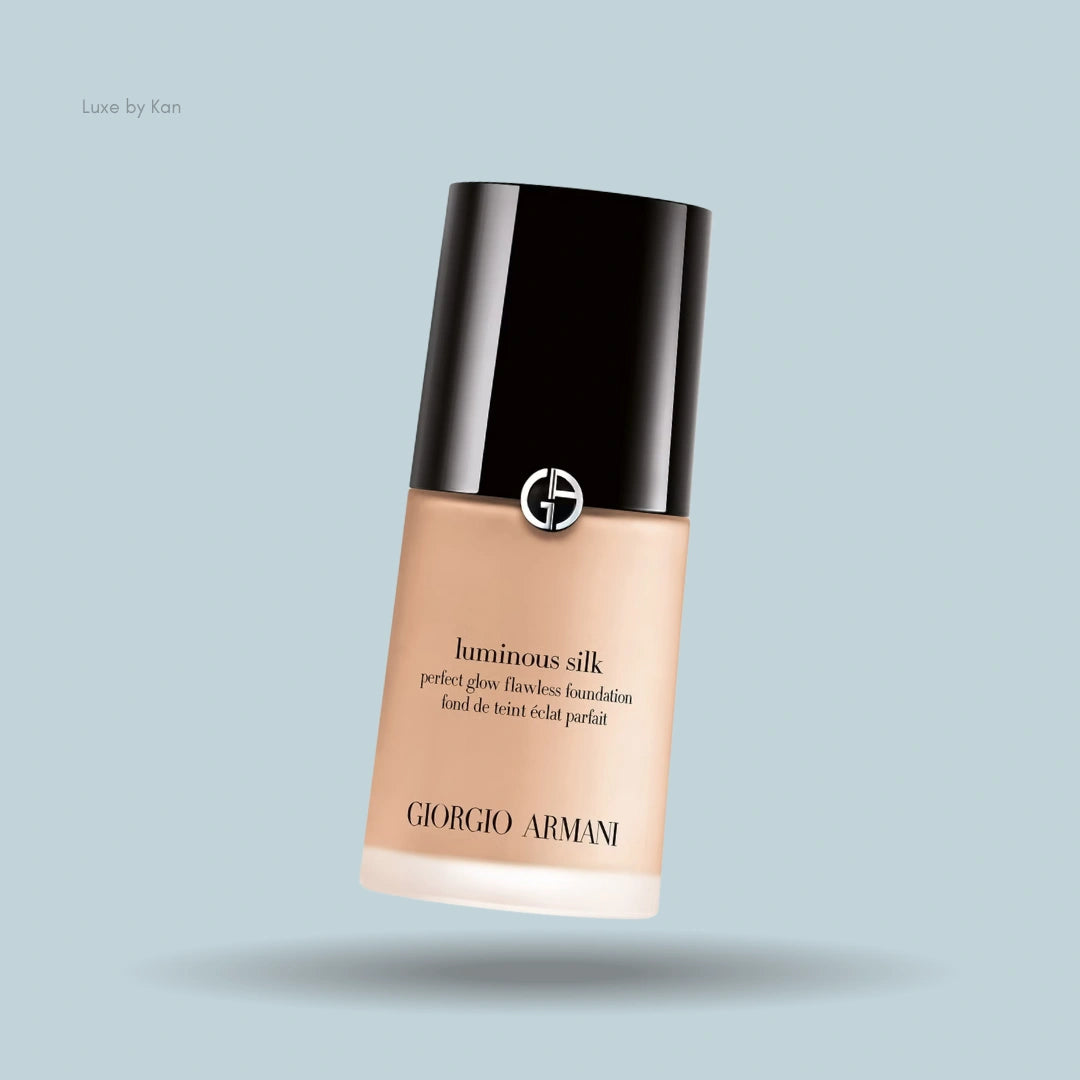 Armani Luminous Silk foundation bottle;  black cap, peach-toned base.