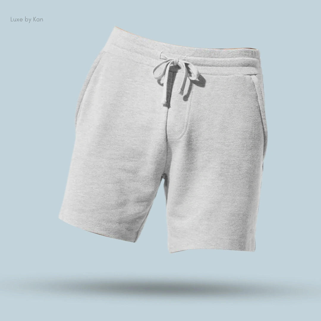 Alo Chill Short in Athletic Heather Grey, flat lay on light blue background