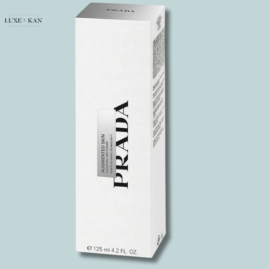 A white Prada product box labeled "Augmented Skin" with elegant branding.