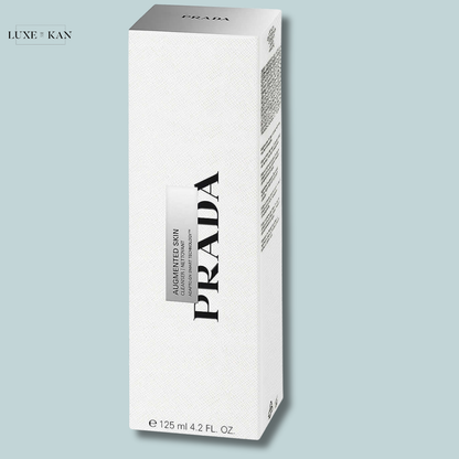 A white Prada product box labeled "Augmented Skin" with elegant branding.