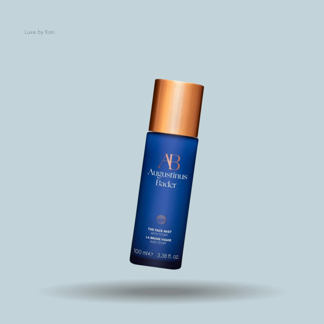 Augustinus Bader blue face mist bottle with gold cap.
