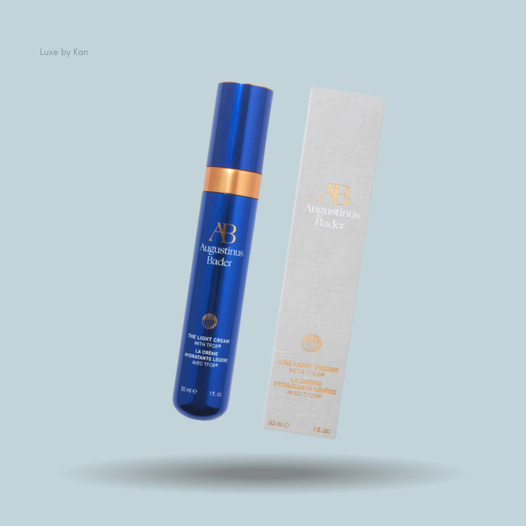 Augustinus Bader The Light Cream angled next to its packaging.