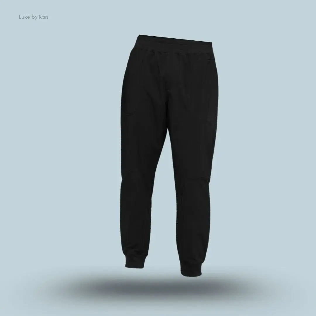 Alo Co-Op Pant in Black, flat lay on light blue background