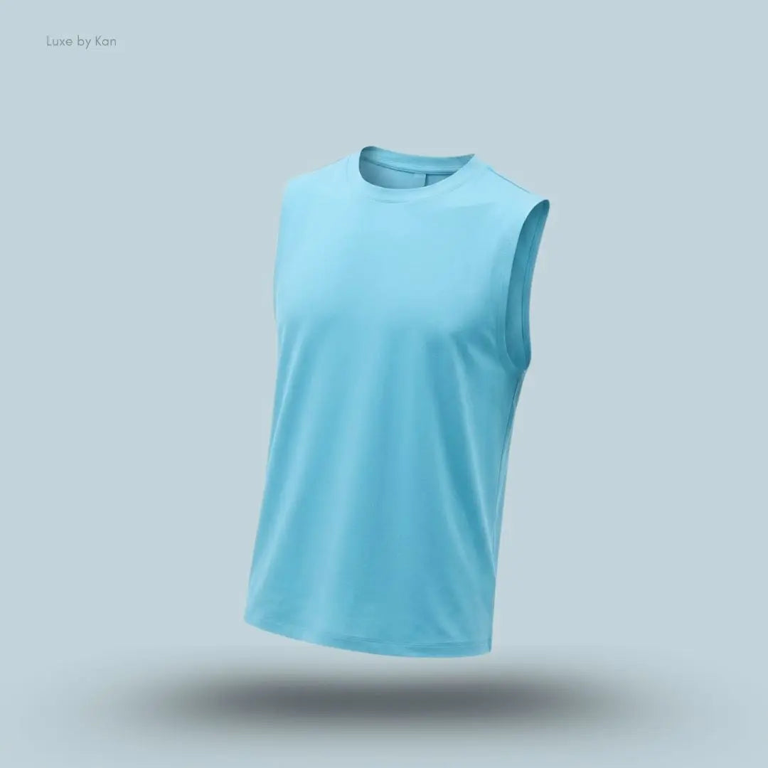 Alo Conquer Muscle Tank in Blue Breeze, flat lay on light blue background
