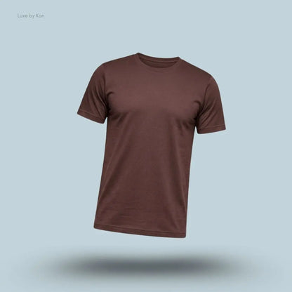 Alo Conquer Reform Crewneck Short Sleeve in Brownstone, flat lay on light blue background