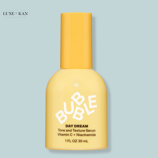 A yellow bottle of BUBBLE Day Dream Tone and Texture Serum with Vitamin C and Niacinamide.