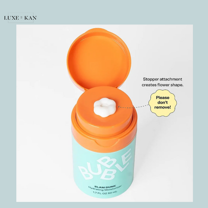 Open packaging of "Bubble Slam Dunk Hydrating Moisturizer," showcasing a flower-shaped stopper with a warning: "Please don't remove!"