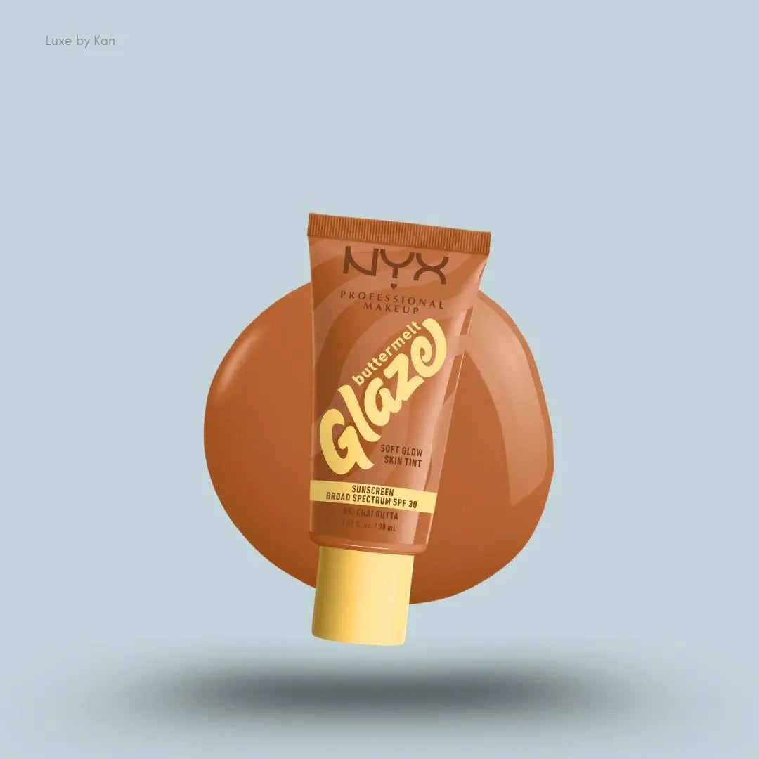 NYX Professional Makeup Buttermelt Glaze Skin Tint SPF 30 tube and swatch on blue background — LBK