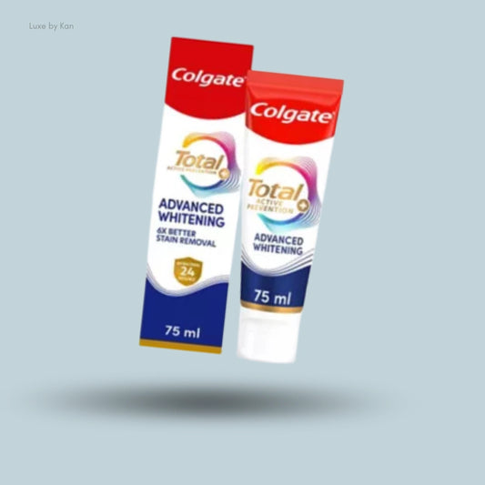 A tube and box of Colgate Total Advanced Whitening toothpaste floating over a shadow against a light blue background.