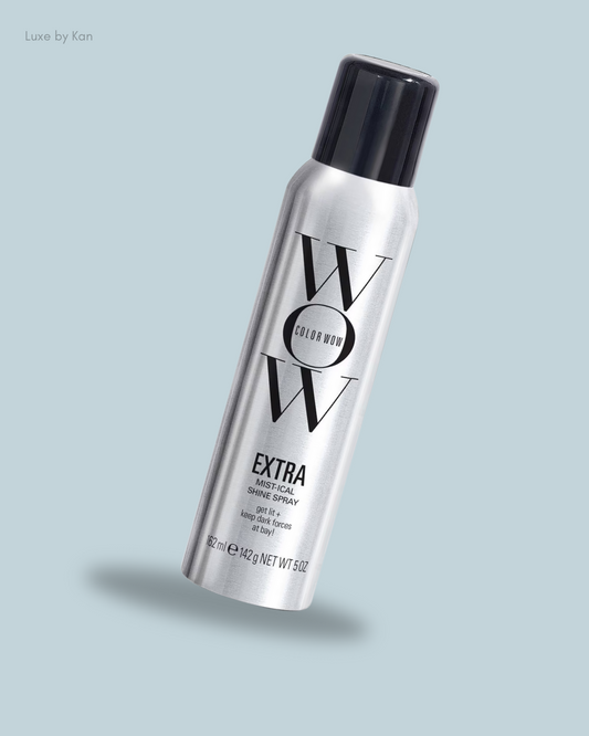 A sleek silver can of Color Wow Extra Mist-ical Shine Spray, designed to enhance shine and protect hair.