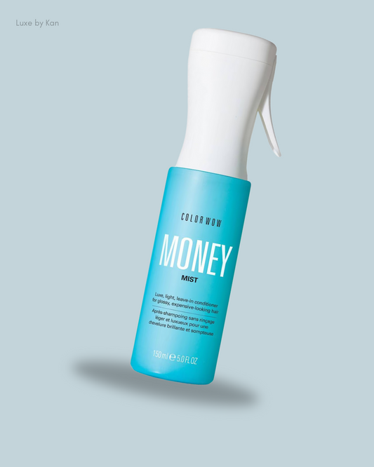 A blue spray bottle of Color Wow Money Mist, a luxe leave-in conditioner for glossy, healthy-looking hair.