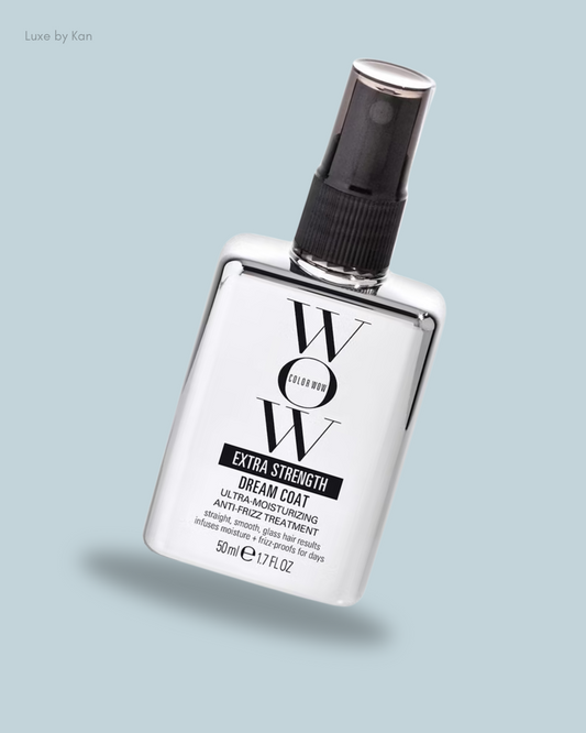 A sleek spray bottle of Color Wow Extra Strength Dream Coat, designed for ultra-moisturizing and anti-frizz hair treatment.