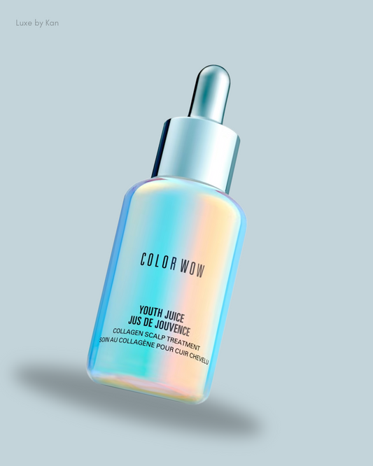 A shimmering bottle of Color Wow Youth Juice collagen scalp treatment, featuring a dropper and a reflective, iridescent design.