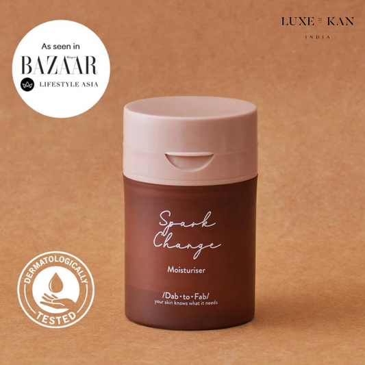 DAB TO FAB "Spark Change moisturiser" with a pink cap, labeled Dermatologically Tested.