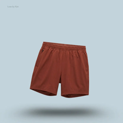 Lululemon Pace Breaker Linerless Short 7" in cranberry charm, front view on light blue background