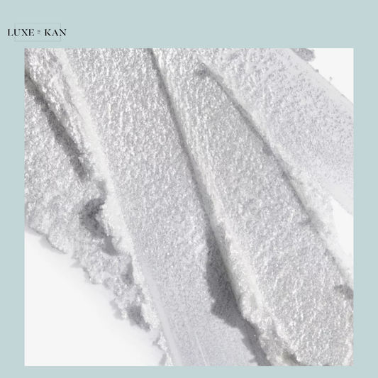 Close-up of shimmering silver textured swatches on a white background, showcasing a luxurious beauty product.
