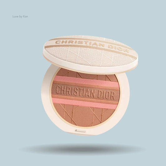 Dior Forever Natural Bronze Glow powder compact, open to reveal powder in bronze tones with pink stripes and imprinted with brand name.
