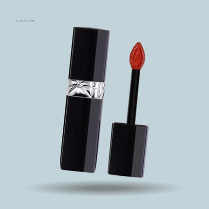 Opened Dior Rouge Dior Forever Lacquer in a sleek black case, featuring a petal-shaped orange applicator.