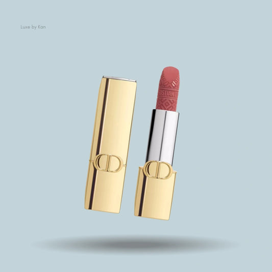 Dior Rouge Dior limited-edition velvet lipstick with a gold case, open to reveal the patterned lipstick.