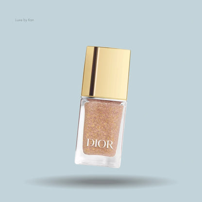 Dior Vernis Top Coat nail polish bottle, filled with glitter polish and golden cap.