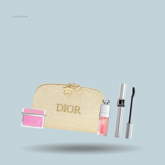 Dior gift set: blush, lip glow oil, mascara, and gold cosmetics bag.