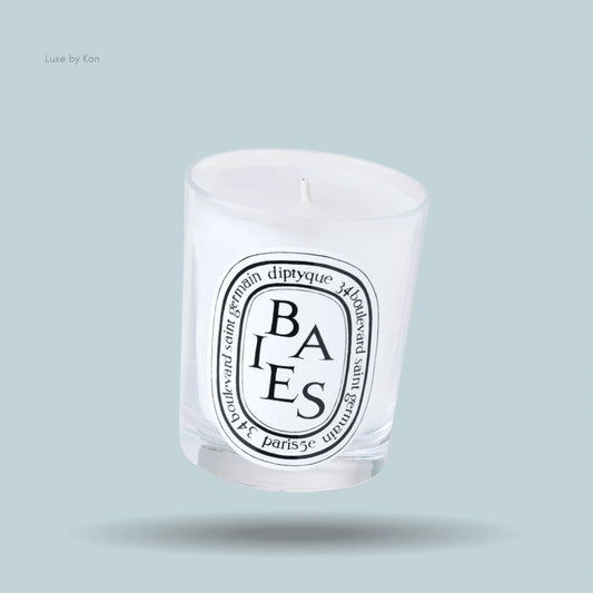 Diptyque Baies scented candle in a clear glass holder with a white label.