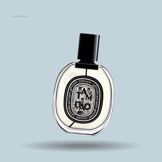 Diptyque Tam Dao Eau de Parfum bottle with oval label and black cap.