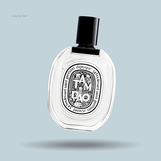 Diptyque Tam Dao Eau de Toilette in an oval-shaped transparent bottle with a black cap and signature black label.